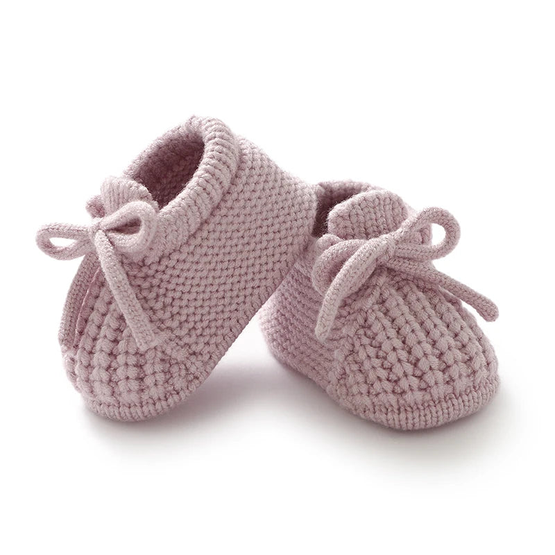 Knitted newborn baby shoes in soft pink, perfect toddler footwear fashion for infants 0-18 months