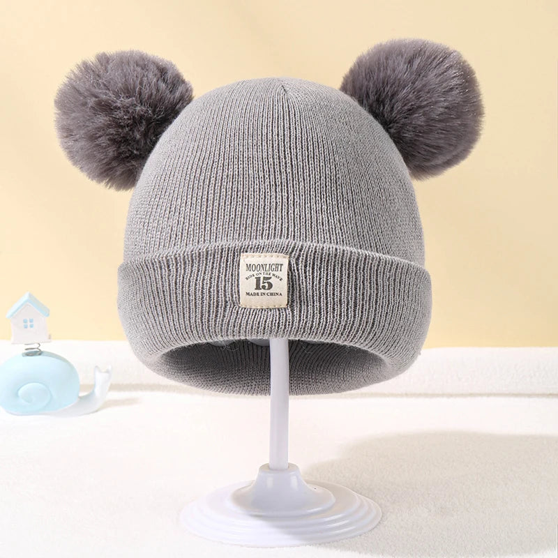 BORA kids pom pom hat in gray with adorable furry pom poms for stylish warmth