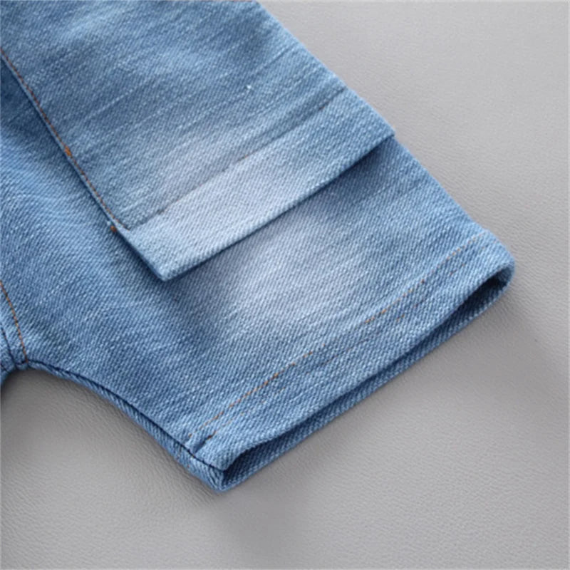 Detail of denim shorts with a small pocket showcasing baby summer fashion set design