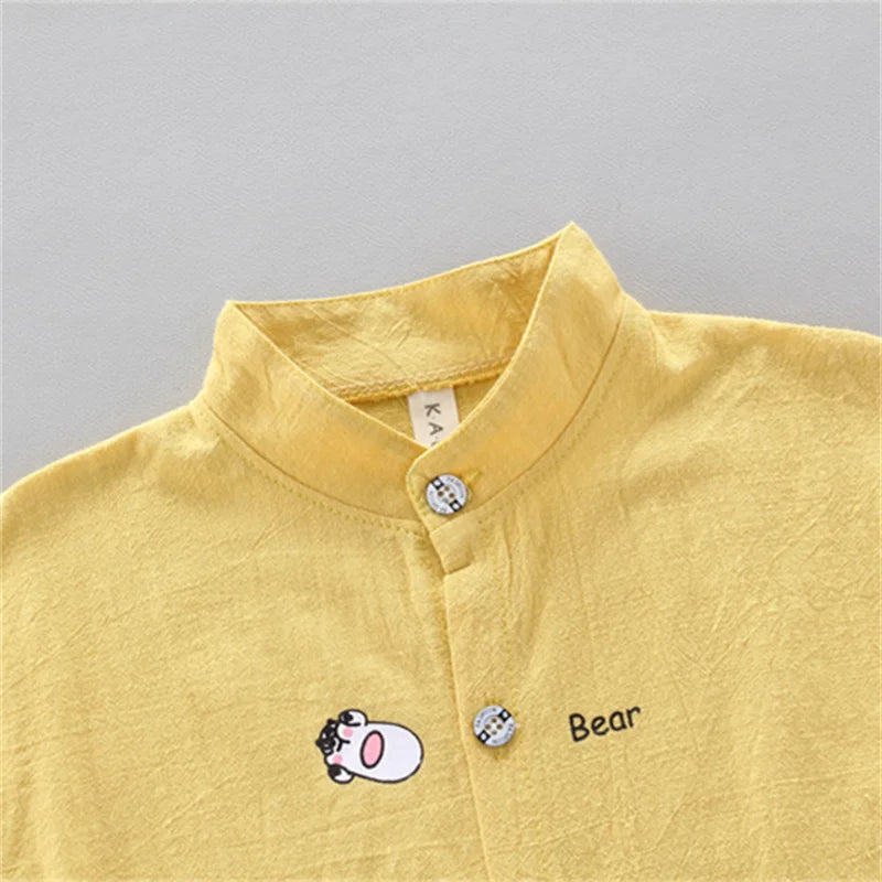 Baby summer fashion set featuring cute animal prints and a stylish collar in soft yellow fabric