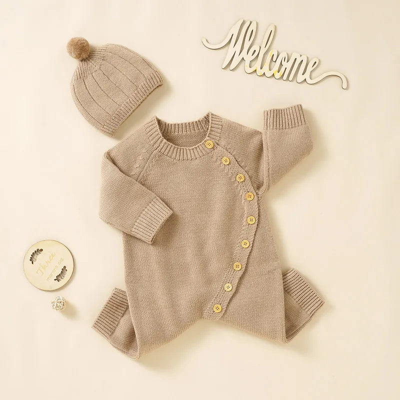 Newborn long sleeve romper with hat in beige knit, featuring button closure for warmth in fall and winter 2023