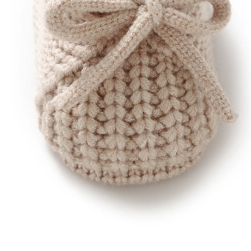 Knitted newborn baby shoes in beige, perfect toddler footwear fashion for infants aged 0-18 months